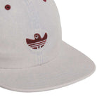 A close-up of the Adidas Gonz Cap Gray Burgundy KS6800, an adjustable light gray hat with a red embroidered bird logo and three horizontal stripes, highlighting its unique style.