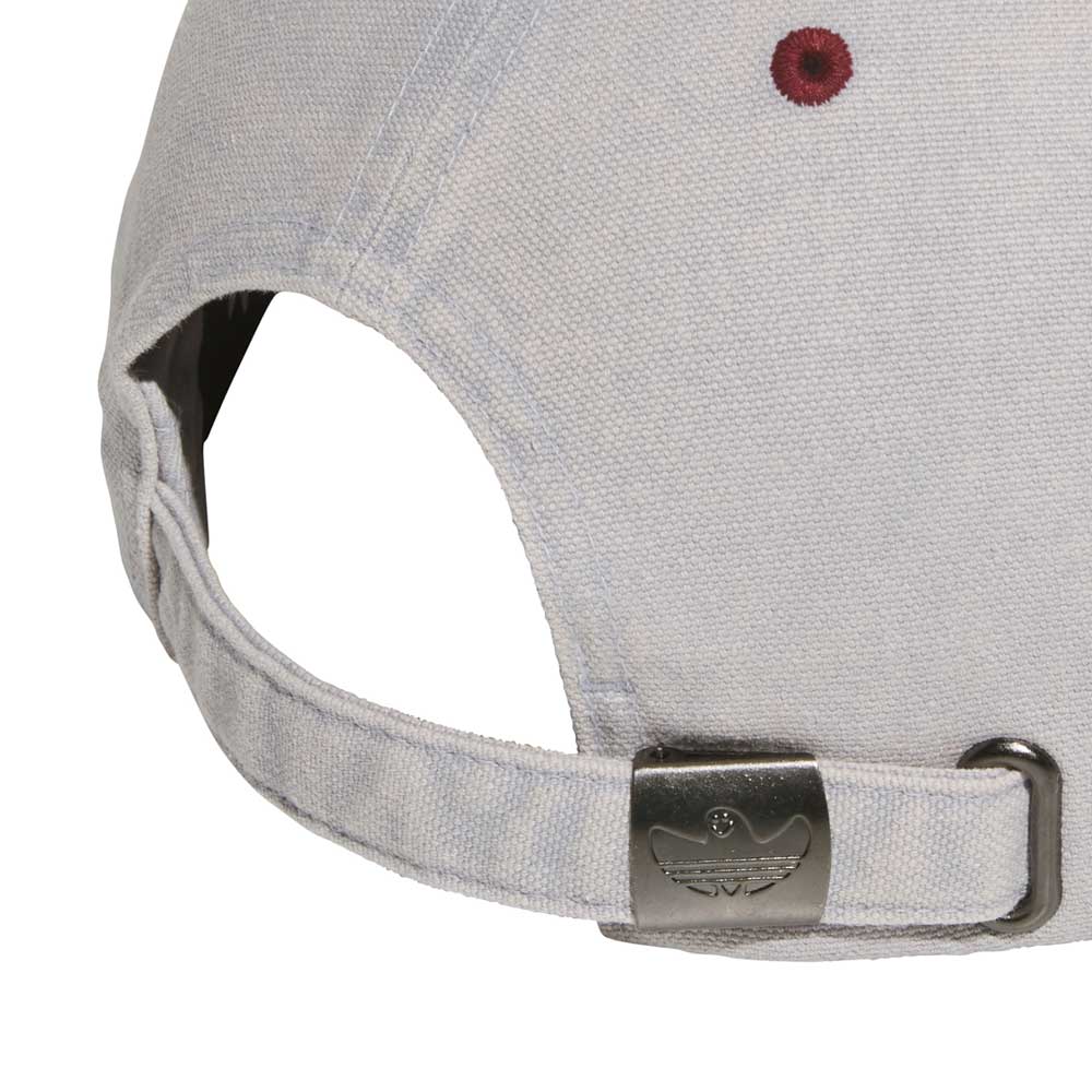 Close-up of the Gonz Cap Gray Burgundy KS6800 by Adidas, an adjustable light gray hat featuring a metal clasp with engraved logo, fabric strap, and a maroon stitched eyelet on the back.