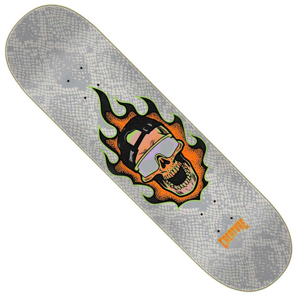 The Gonzalez Bonehead Pro 8.375in x 32in Creature Deck features a durable gray, 7-ply North American Maple construction with a striking snake-skin pattern. The deck is adorned with a flaming skull graphic wearing sunglasses and a cap, along with the word “CREATURE” in bold orange text near the tail—delivering both longevity and bold style for any skater.