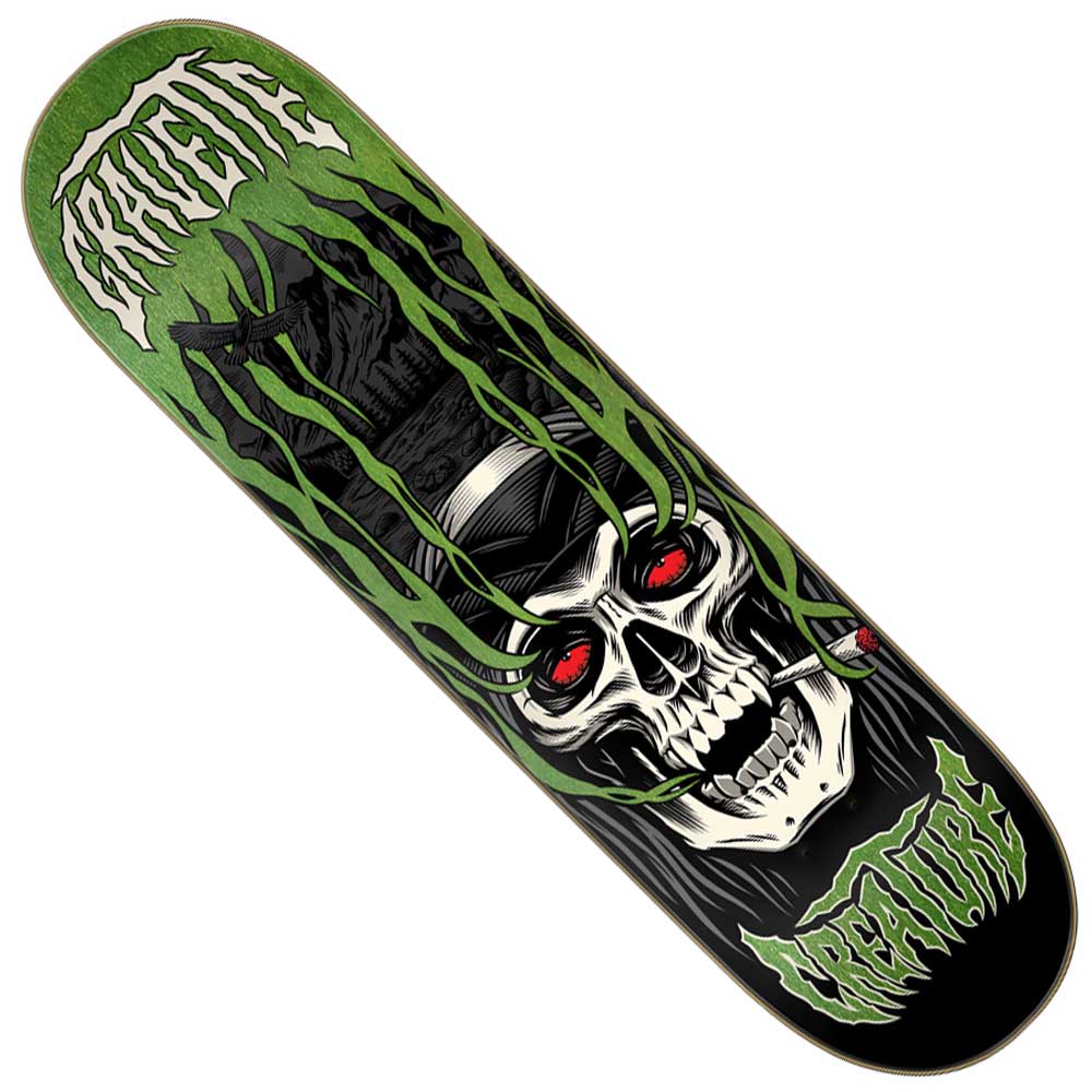 Pro Deck description: The Gravette Hippie Skull IV Pro 8.3in x 32.2in Creature Deck showcases vivid green Creature branding and eye-catching Hippie Skull artwork—a grinning skull with glowing red eyes, a cigarette in its mouth, and menacing green claw-like forms surrounding its face on a sleek black background.