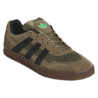 A pair of gray and black Mark Gonzales KJ0281 Aloha Super Suede Skateboarding Shoes by Adidas, featuring black stripes, an Adidas logo on the tongue, and a matching sole, is displayed at an angle on a white background. These skateboarding trainers are crafted with a suede upper and draw inspiration from the legendary adidas Aloha Super shoes.