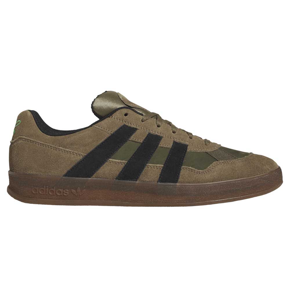 Introducing the Gray Black Mark Gonzales KJ0281 Aloha Super Suede Skateboarding Shoes—these Adidas sneakers feature a durable suede and textile upper, classic black stripes, subtle gray tones with unique accents, a dark outsole, and signature Adidas branding on the side and heel, drawing inspiration from iconic skate trainers.