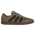 Introducing the Gray Black Mark Gonzales KJ0281 Aloha Super Suede Skateboarding Shoes—these Adidas sneakers feature a durable suede and textile upper, classic black stripes, subtle gray tones with unique accents, a dark outsole, and signature Adidas branding on the side and heel, drawing inspiration from iconic skate trainers.