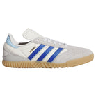 A gray Adidas Busenitz Indoor skateboarding shoe, model KZ8895, with royal blue stripes, a gum sole, and “BUSENITZ” written in gold above the stripes. The shoe features suede construction with perforations on the toe area and a light blue detail on the heel.