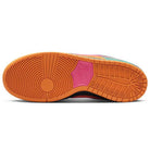 The image shows the sole of Nike SB Dunk Low Pro Green Noise Watermelon Light Curry sneakers, featuring an orange base, circular tread, a pink mid accent, and teal-blue upper details for vibrant skateboarding style.