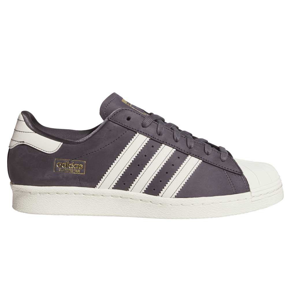 The Grey White Superstar 80 ADV HQ9289 Adidas Skateboarding Leather Shoe features white stripes, a white toe cap and sole, gold adidas branding on the side, and a classic lace-up design for iconic skate style.