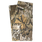 Groundwork 2 Cargo Pants Realtree APX Bottom Mens Independent—folded camouflage cargo pants showcasing authentic leaf and bark patterns in brown, green, and gray hues. Crafted with durable ripstop fabric, these pants feature visible back and front pockets in the distinctive REALTREE colorway.
