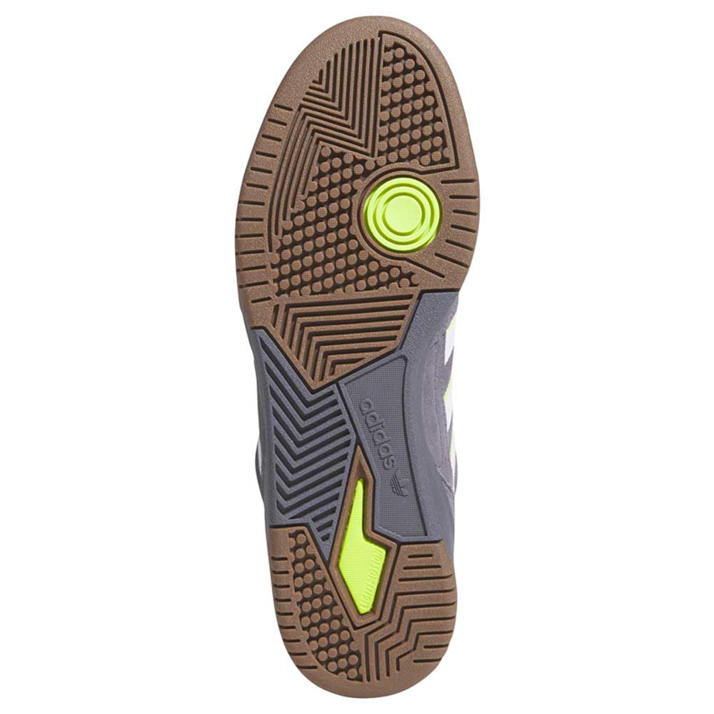 The image shows the sole of the HQ4813 Gray White Green Tekkira Adidas Skateboarding Suede Shoes with a gum outsole, geometric tread patterns, neon yellow and gray accents, and the Adidas logo in the center.
