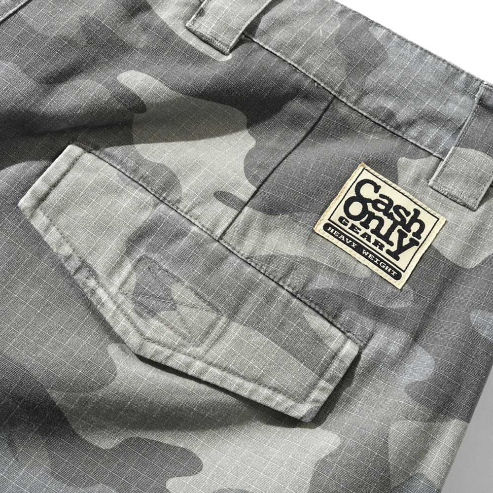 Close-up of Halfway Shorts Grey Camouflage Ripstop (COD152601), featuring baggy fit, flap pockets, and a rectangular patch above reading "Cash Only" in bold with smaller text below.