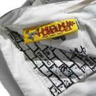 Close-up of the inside of the Halfway Shorts Grey Camouflage Ripstop Cash Only COD152601, showing a yellow HOLIDAY CASH ONLY DIST. label with cartoon graphics and a black-and-white text and brick patterned lining.