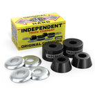 A box labeled "Hard 94a Original Independent Stage 4 Genuine Parts Black Cushions" is behind four black skateboard bushings and four silver washers—authentic parts, ideal for upgrading with Independent Stage 4 cushions.