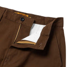 A close-up of the waist and zipper area of the Hecho Por Skate Pant Anti Hero Skateboards Brown, showing the partially open zipper with white inner lining and waistband label—ideal for those hunting limited drops on Skateshop Day.
