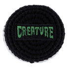 A round, black and gray crocheted High Country Warm Up Foot Bag by Creature—ideal for skate fans or as a unique unisex skateboarding accessory.