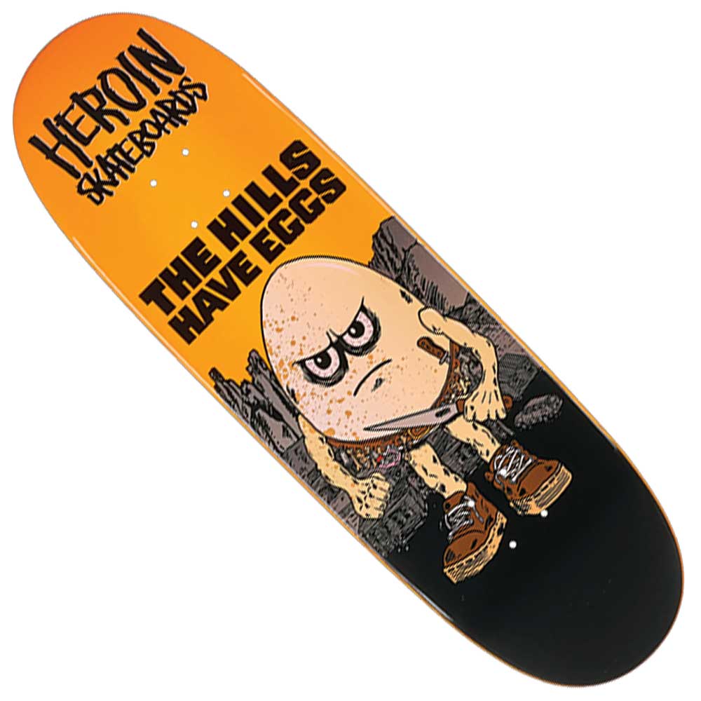 The Hills Have Eggs 9.5x32 Heroin Skateboards Deck Shaped features a unique graphic of an angry egg holding a knife and wearing boots, surrounded by rocks, with “Heroin Skateboards” and “The Hills Have Eggs” text—perfect for fans of bold Heroin deck designs.