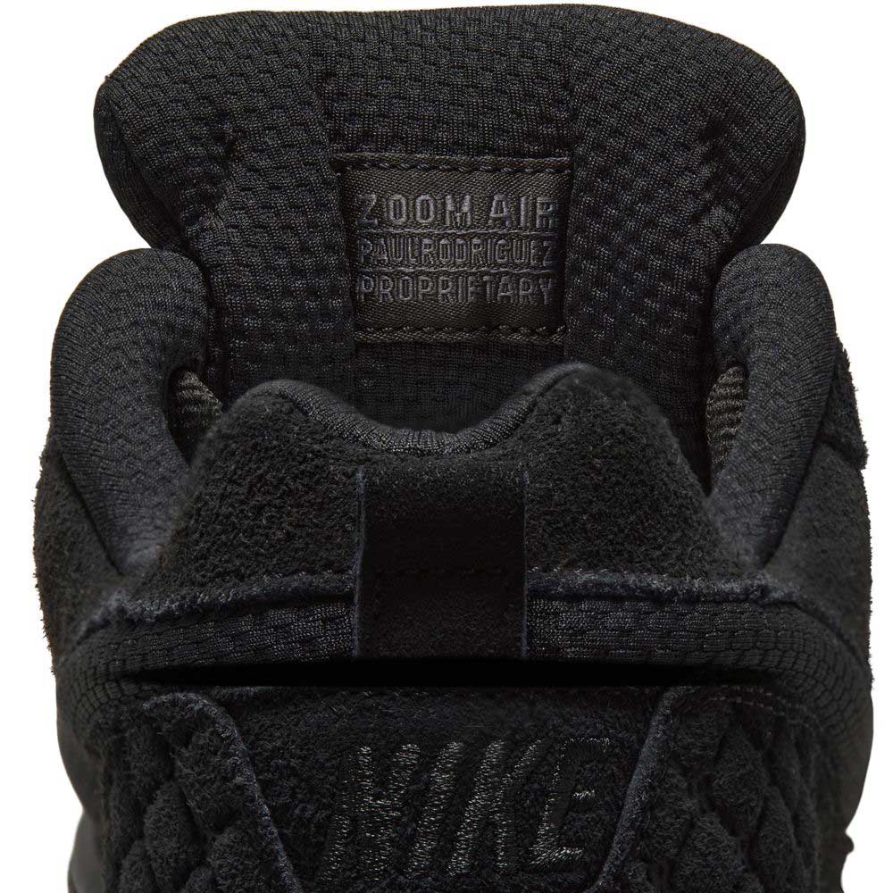 Close-up of the tongue on the IQ6827001 Black Gum Light Brown Paul Rodriguez Zoom Air Low Suede Skateboarding Shoes, with a woven Zoom Air Paul Rodriguez label and NIKE logo. Features include Air Zoom cushioning and a durable rubber outsole.