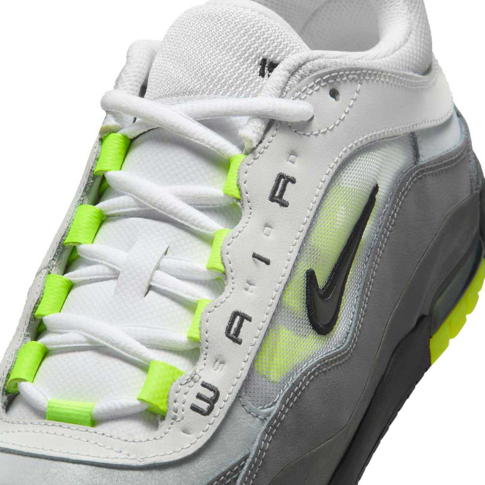 Close-up of the IR1887002 Black Neon Yellow Anthracite Air MAX Ishod Nike SB skateboarding shoe, featuring mesh panels, white laces, neon yellow accents, AIR by the eyelets, a black Swoosh on the side, and Max Air cushioning.