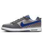 The IU7835001 Flint Grey Deep Royal Blue Paul Rodriguez Zoom Air Low Suede Skateboarding Shoes feature gray suede, a blue Swoosh and accents, quilted heel stitching, white midsole with visible Zoom Air cushioning, and durable traction.