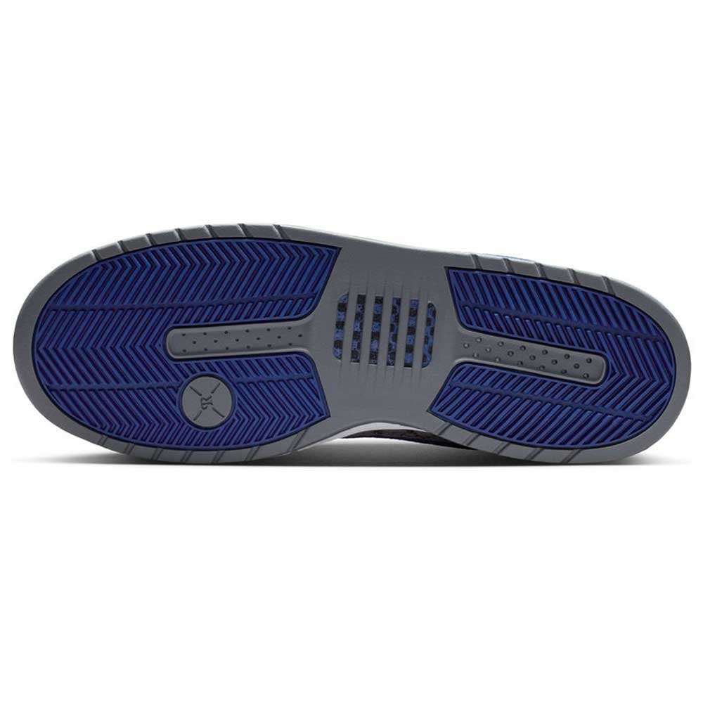 The image shows the sole of the IU7835001 Flint Grey Deep Royal Blue Paul Rodriguez Zoom Air Low Suede Skateboarding Shoes, mainly gray with dark blue sections, a herringbone tread for traction, and a small circular logo near the heel.