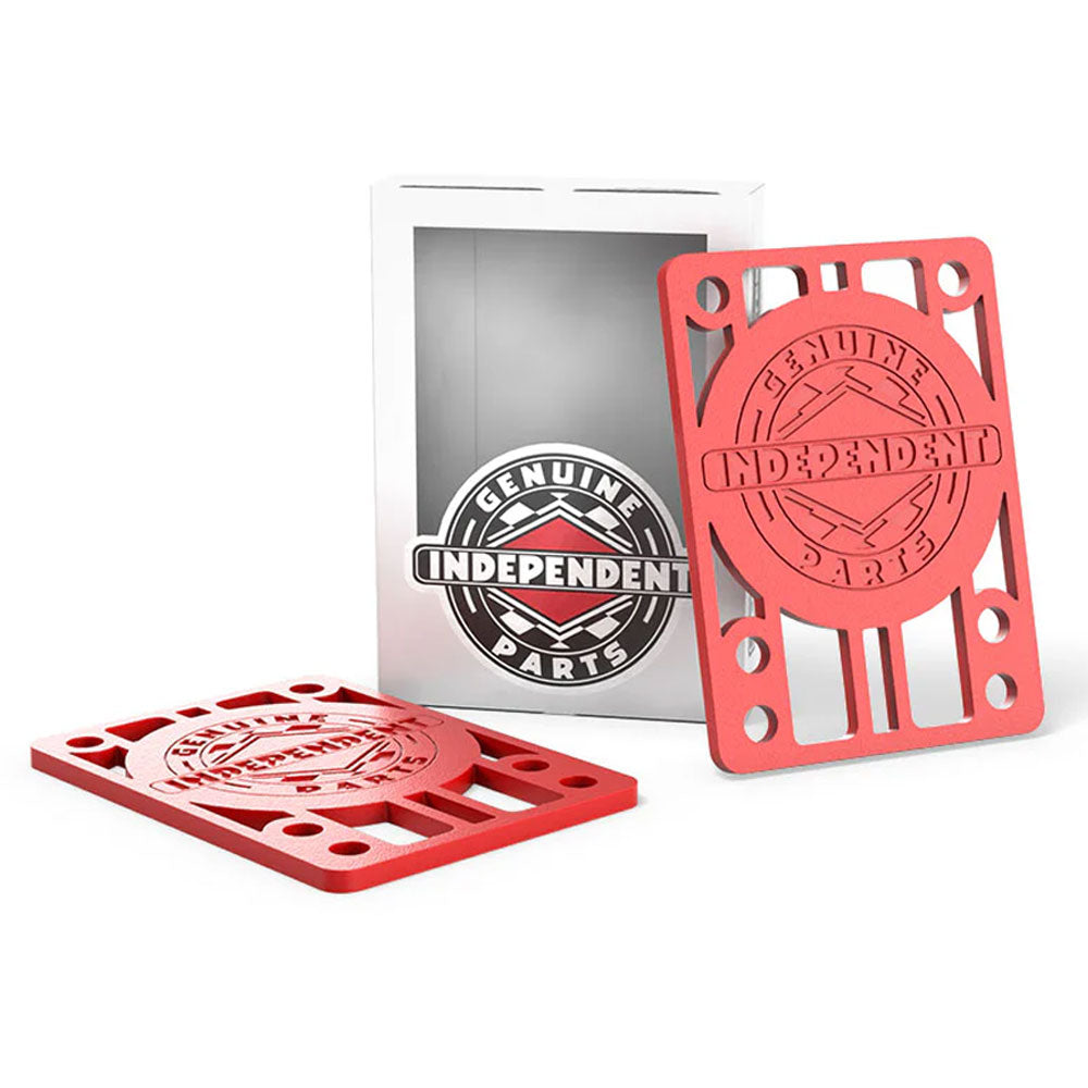 Two red rectangular Independent Riser 1/8th pads from the Set of TWO, each featuring the Genuine Parts logo—ideal as durable TPU skateboard risers—with one pad upright and one lying flat beside a white and clear product box displaying the same iconic logo.
