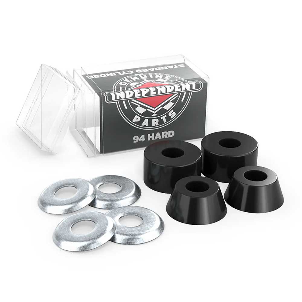 A set of four Indy Standard Cylinder Cushions Hard 94A Black skateboard bushings with high rebound urethane and four silver washers, shown in front of a clear plastic box labeled Independent Parts 94 Hard.