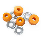 Four Indy Standard Cylinder Cushions Medium 90A Orange and four round silver washers are arranged on a white background. The urethane bushings have a central hole and are paired with flat washers.