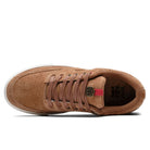 Top view of Poet Suede Brown Suede I Path Shoes Skateboarding, featuring a perforated toe box, brown laces, red accent and gold logo on the tongue, white sole, and visible insole logo.