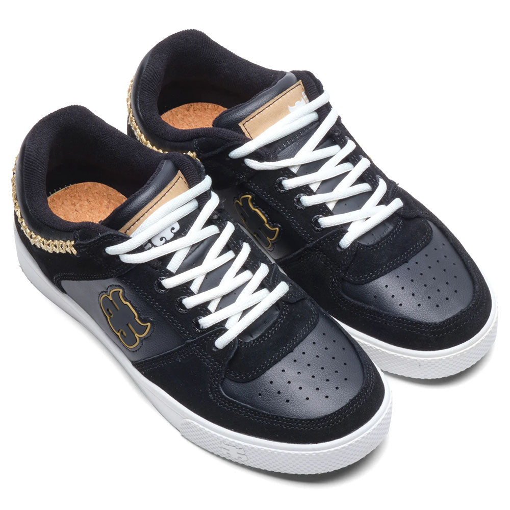 The Kenny Reed Low Vulc Black Leather Suede I Path Shoes feature white soles and laces, gold accents, a gold chain on the heel, and a stylized bear logo—perfect statement skate shoes inspired by the iconic style.