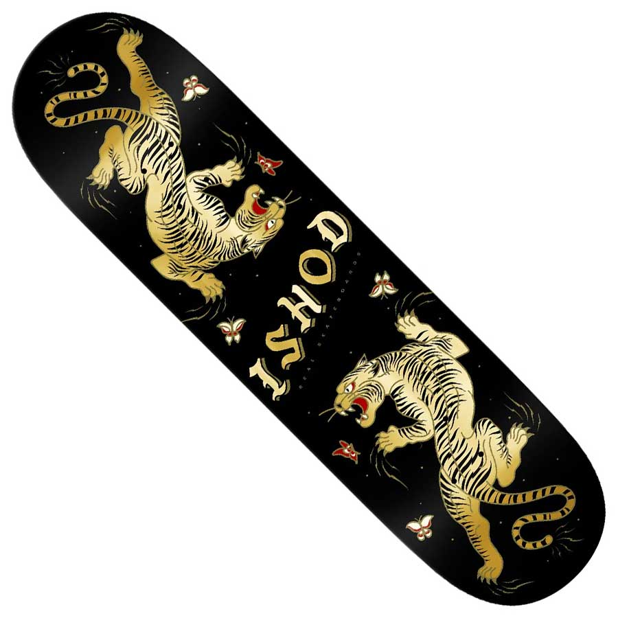 The Ishod Cat Scratch Twin Tail 8.5x32.2 Black Real Skateboard Deck features two yellow tigers with red mouths facing each other, "ISHOD" in bold text, and scattered red-and-white flowers on a sleek black background.