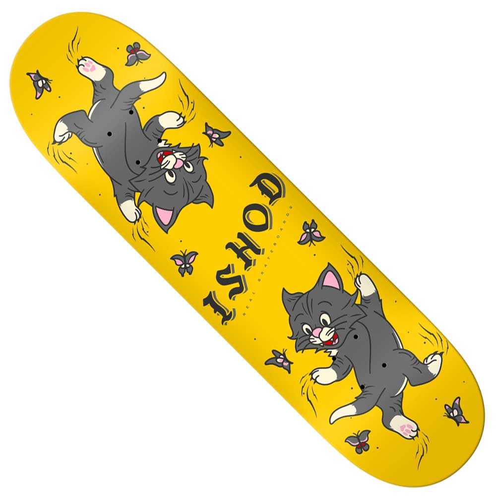 The Ishod Kitten Scratch 8 Twin Tail Real Skateboards deck features cartoon illustrations of a gray cat chasing purple flies, with the bold word ISHOD placed between the two cat drawings. This playful design stands out, and its twin tail shape adds versatility for every rider.