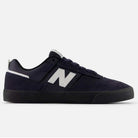The Jamie Foy Eclipse White 306 NSN New Balance Numeric Suede Skateboarding Shoe features navy blue and black suede, a white N logo, black sole, dark laces, and is shown side profile against a plain white background—ideal for skateboarding.