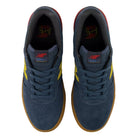 Top view of a pair of navy blue suede Jamie Foy Cup 306 CON New Balance Numeric skateboarding shoes with yellow side logos and durable gum rubber soles.