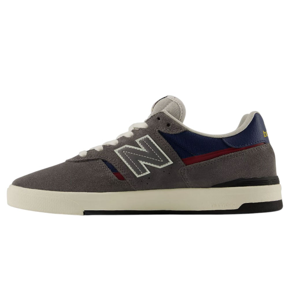 Jamie Foy Cup 306 CON New Balance Numeric Suede Skateboarding Shoes featuring a gray suede upper, white sole, navy and red accents, white laces, and a prominent N logo on the side are shown in profile facing left on a plain white background.