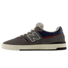 Jamie Foy Cup 306 CON New Balance Numeric Suede Skateboarding Shoes featuring a gray suede upper, white sole, navy and red accents, white laces, and a prominent N logo on the side are shown in profile facing left on a plain white background.