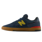 Navy blue Jamie Foy Cup 306 CON New Balance Numeric suede skateboarding shoes with a yellow N logo and a gum rubber sole.