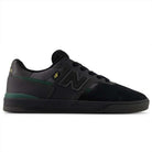 The Black Nightwatch Green Jamie Foy Cup 306 CSP New Balance Numeric suede skateboarding shoes feature green and gold accents, a mesh upper, signature N logo, and a flat vulcanized sole inspired by the Jamie Foy pro model.