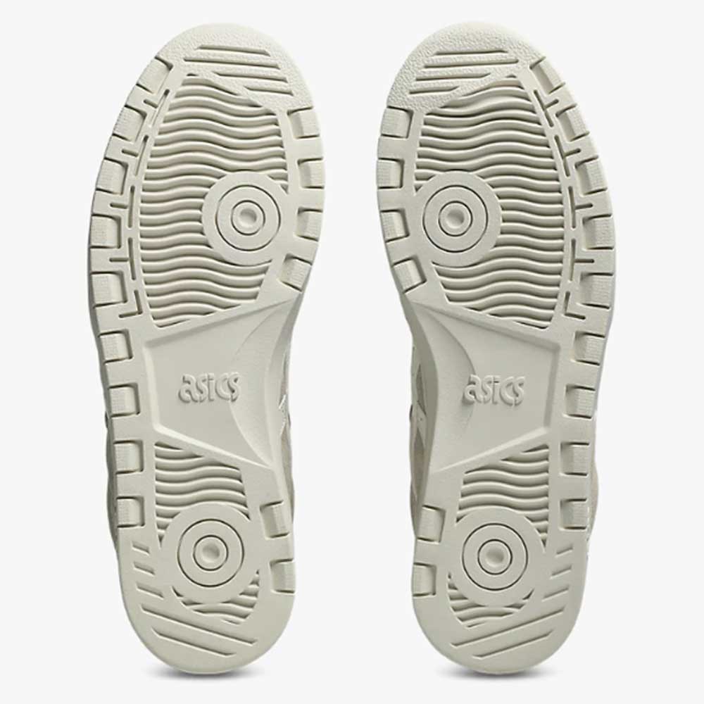 Top view of two Japan Pro MT Asics Feather Grey Cream 1201B033020 skate shoes soles, showcasing durable suede accents, textured patterns, circular tread designs, and the ASICS logo embossed at the center of each sole.