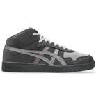The Japan Pro MT ASICS Graphite Gray Cay Red 1203B088 021 skate shoe features a gray suede upper, white laces, light gray signature side stripes, a dark rubber sole, and offers a minimalist, classic mid-top skate style.