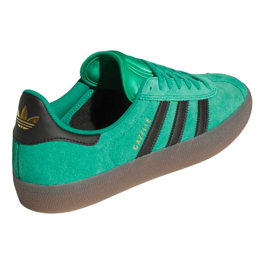 The KI3206 Green Black Gazelle ADV Adidas Skateboarding suede shoes feature green suede, black stripes, a brown rubber sole, gold GAZELLE text on the side, and a gold trefoil logo on the black heel—perfect for everyday adventures.