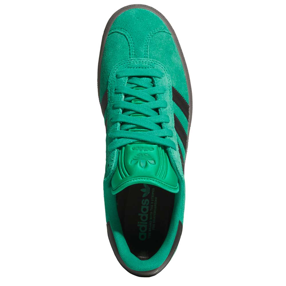 Top view of KI3206 Green Black Gazelle ADV Adidas Skateboarding Suede Shoes with black stripes, green laces, and a logo on the tongue. This classic silhouette is perfect for everyday adventures.