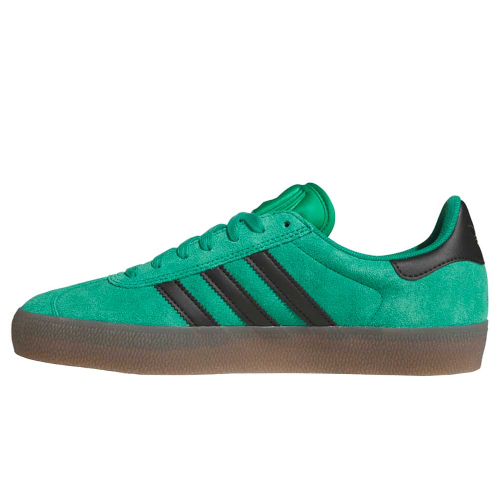 The KI3206 Green Black Gazelle ADV Adidas Skateboarding Suede Shoe features a classic silhouette with green suede, black stripes, and a brown rubber sole—iconic style built for everyday adventures.