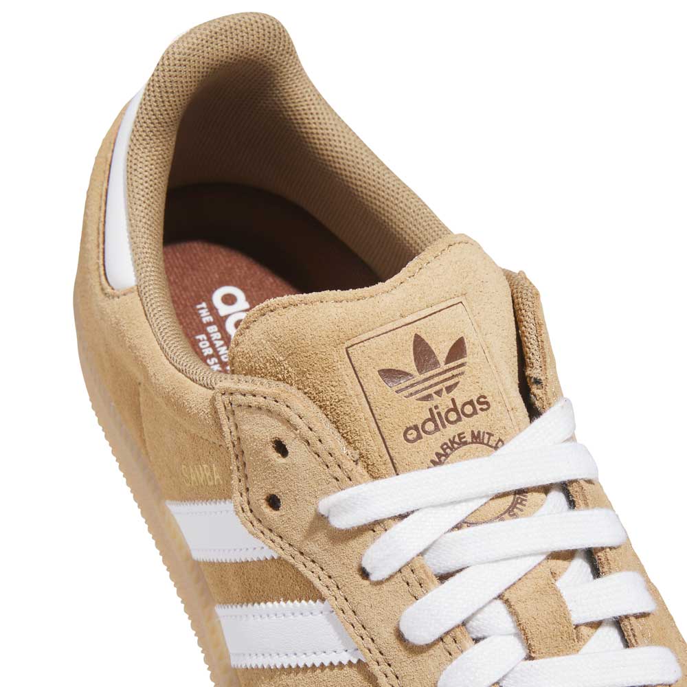 Close-up of KI5089 Tan White Samba ADV Adidas Skateboarding suede shoes, featuring white laces, signature side stripes, adidas logo on the tongue, and a brown insole with white branding.