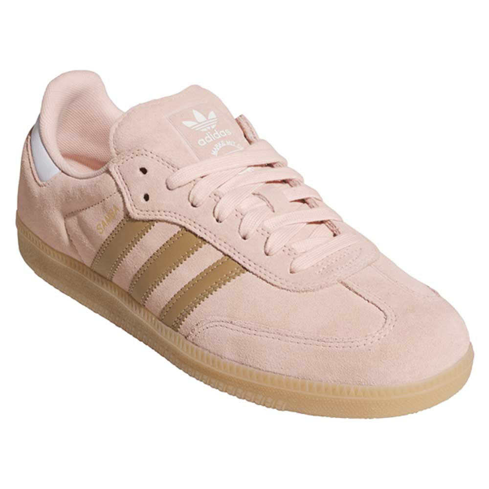 The KI5090 Pink Gum Samba ADV Adidas Skateboarding Suede Shoes feature a light pink suede upper, gold stripes and SAMBA detailing, white heel accent, gum sole, and the adidas logo on the tongue.