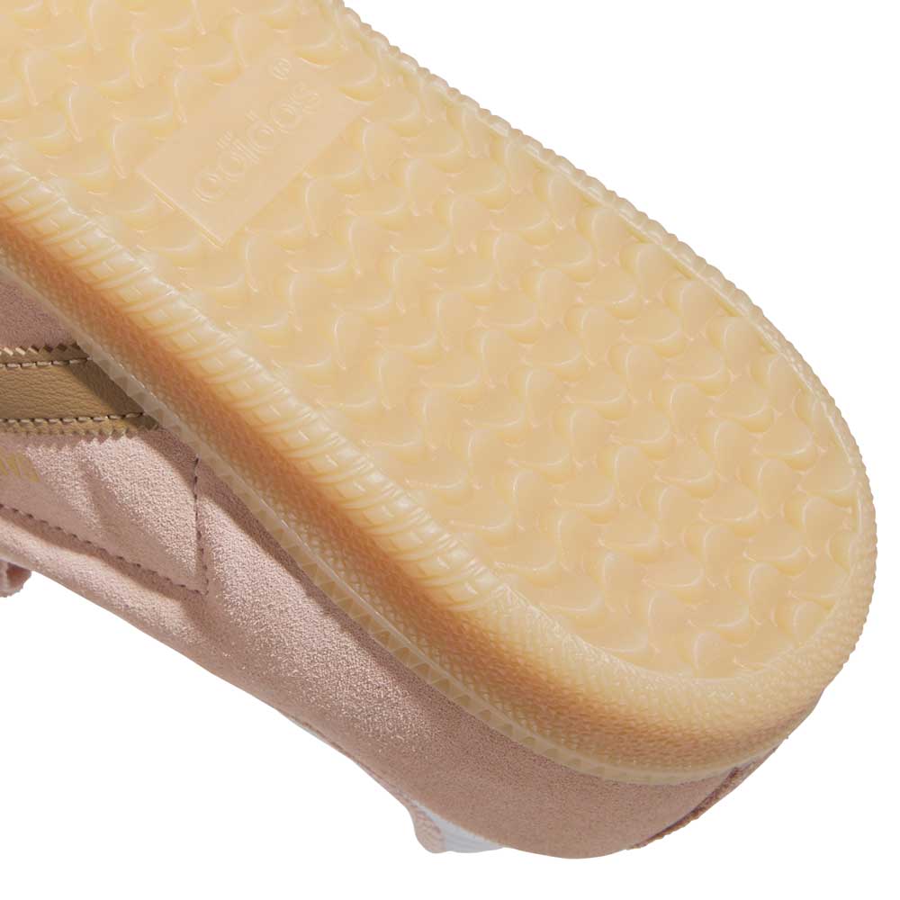 Close-up of the sole and side of the KI5090 Pink Gum Samba ADV adidas Skateboarding Suede Shoe, featuring a textured beige rubber outsole and part of the adidas logo visible on the sole.