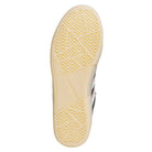 The image shows the sole of the KJ0194 Black Clear Tyshawn Adidas Skateboarding Leather Shoes with a light beige herringbone tread and "adidas" embossed at the center. The black leather upper features white and red accents on the side.