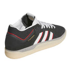 The KJ0194 Black Clear Tyshawn Adidas Skateboarding Leather Shoes feature a black upper with white and red accents, white laces, beige sole, three white stripes, gold TYSHAWN text, and are designed for stylish skateboarding.
