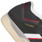 Close-up of KJ0194 Black Clear Tyshawn Adidas Skateboarding Leather Shoes, featuring a white sole, white stripe, red accents, gold TYSHAWN lettering, and Adidas logo on the midsole. Made from premium leather for skateboarders.