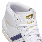 Close-up of KJ0210 White Blue Pro Model 80 ADV Adidas Skateboarding shoes with a leather upper, gold Adidas branding on the tongue and side, blue side stripes, plus white laces and stitching.