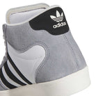 Close-up of the heel of the KJ5031 Adidas Superskate Gray Black Adidas Skateboarding Shoes, featuring a gray and white design, black and white stripes, suede upper, and trefoil logo—a timeless skateboarding classic.