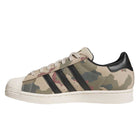 The KJ5120 Camouflage Black Superstar ADV Adidas Skateboarding Suede Shoes feature a green, beige, and brown camo pattern, black stripes and heel tab, and a white sole—ideal for classic skate shoe fans.