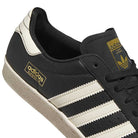 Close-up of KK5003 Black White Superstar 80 ADV Adidas Skateboarding Leather Shoes, featuring three white stripes, gold adidas branding on the side and tongue, and a classic textured white sole—style reimagined for skateboarding.